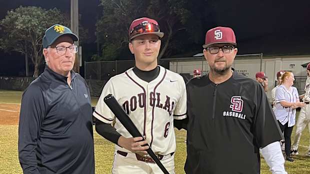 Niko Benestad (center) was named MVP photo BCAA Tournament. He posed with Pat McQuaid (left) and Stoneman Douglas head coach Todd Fitz-Gerald. (3/1/2024)